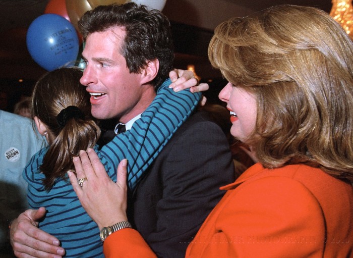 Scott Brown is hugged by his daughter (unsure which one) as his wife Gail Huff, right, joins the celebration on election night. Scott Brown was elected to serve in the State of Massachusetts House of Representatives.