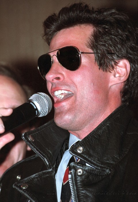 Scott Brown in shades and a leather jacket. I'd have to do more research to figure out why he is dressed as such, but Scott Brown has always be up for doing what it takes. Looks like he is having fun.